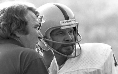 Oakland Raiders quarterback Ken Stabler (12) talks with Hall of Fame head coach John Madden during the Raiders 20-14 loss to the Los Angeles Rams on December 4, 1977 at the Los Angeles Memorial Coliseum in Los Angeles, California.  (AP Photo/NFL Photos)
